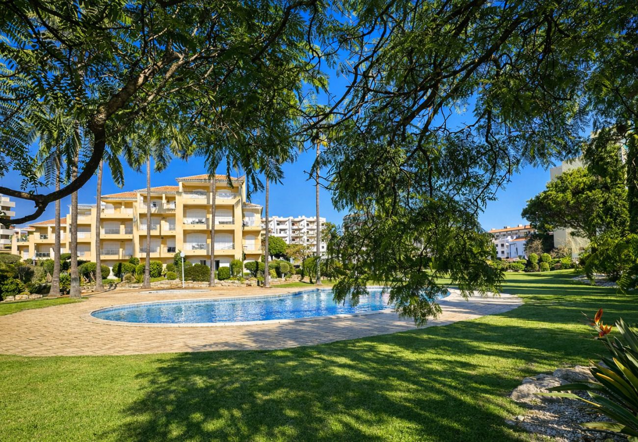 Shared swimming pool in a gated community with gardens in Vilamoura
