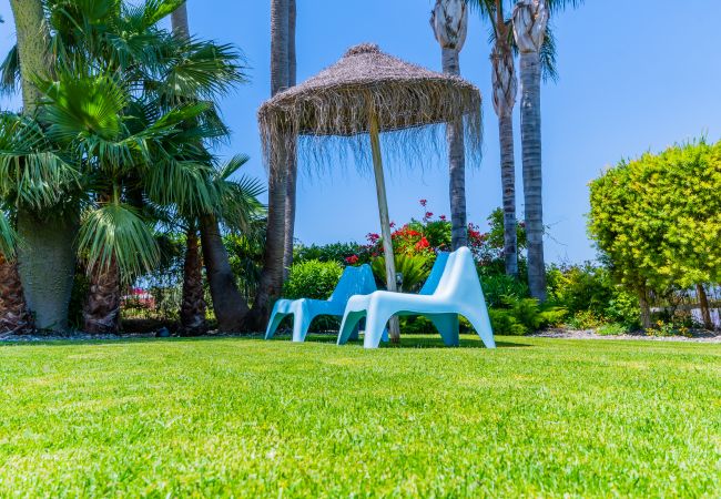 Villa with Heated Pool and Sauna | Cubo's Holiday Homes	 Garden of this villa in Alhaurín de la Torre