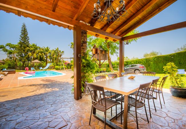 Villa with Heated Pool and Sauna | Cubo's Holiday Homes	 Terrace of this villa in Alhaurín de la Torre