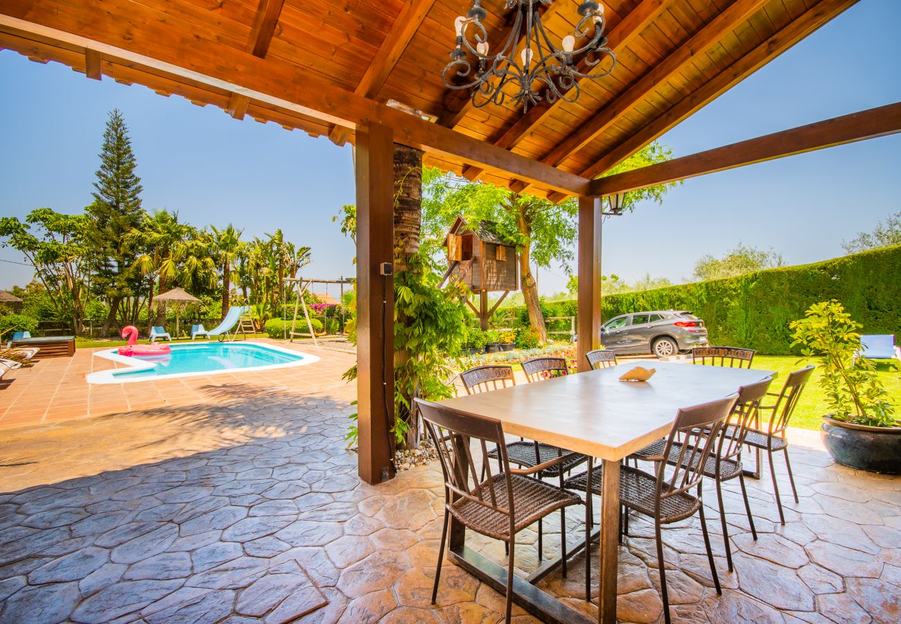 Villa with Heated Pool and Sauna | Cubo's Holiday Homes	 Terrace of this villa in Alhaurín de la Torre