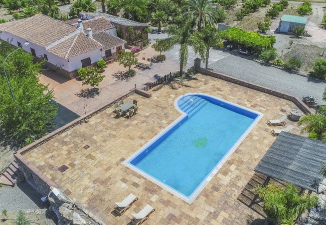 Family rural house ideal for holidays | Cubo's Holiday Homes Swimming pool of this farm in Alhaurín el grande