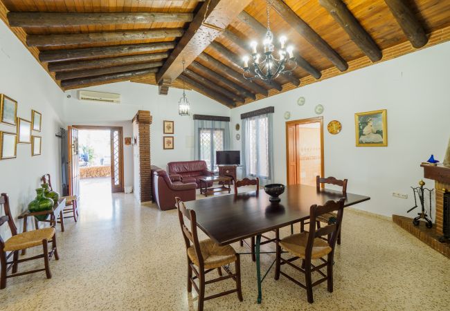 Family rural house ideal for holidays | Cubo's Holiday Homes Dining room of this farm in Alhaurín el Grande
